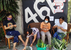 Palm Sunday FCJ Sisters giving palms to their neighbours in Manila during COVID-19 pandemic