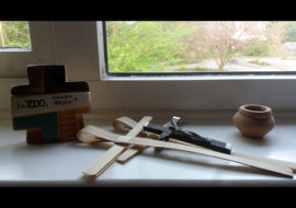 Crucifix Amar y Servir on Spring Window