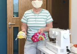 Sr Bernie with the face masks she has made