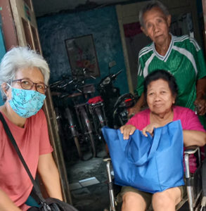 FCJ sisters in Yogyakarta Indonesia delivering gifts to neighbours for Idul Fitri