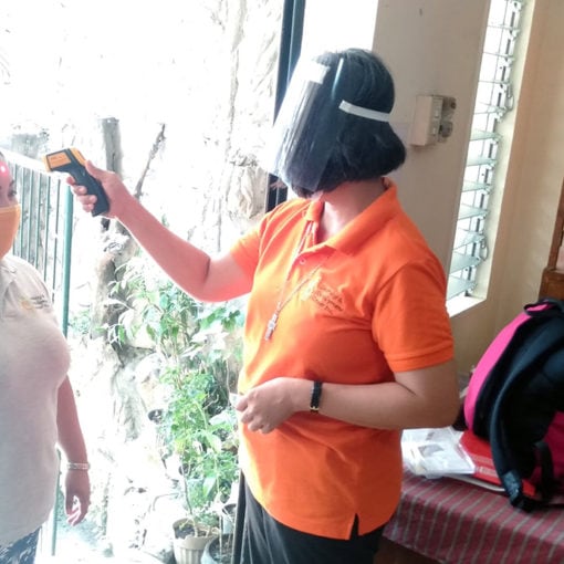SR Ciony taking temperature of FCJ Center visitors