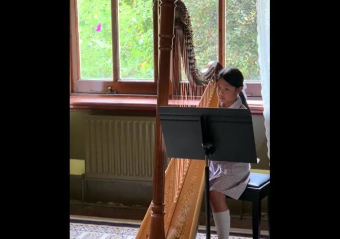 Student playing the harp at Genazzano FCJ College